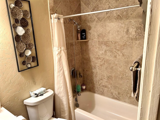 full bathroom featuring a textured wall, toilet, and shower / bathtub combination with curtain