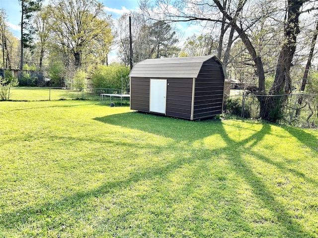 view of yard featuring a storage unit