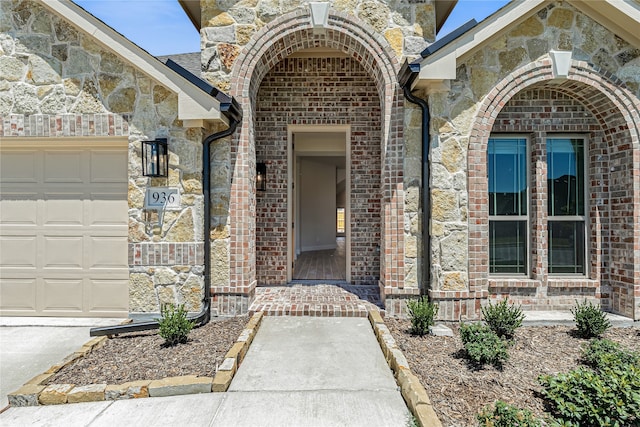 entrance to property featuring a garage