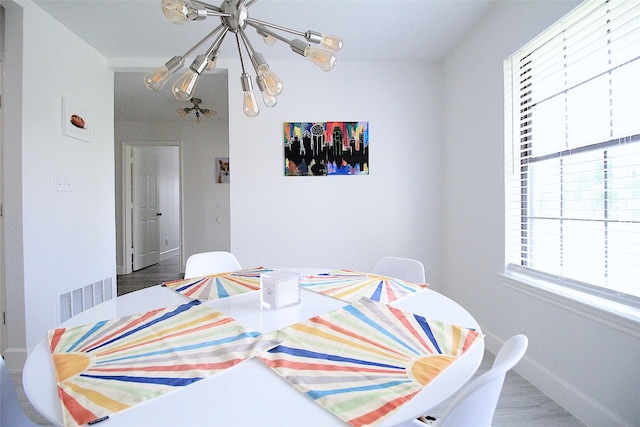 dining space featuring hardwood / wood-style floors