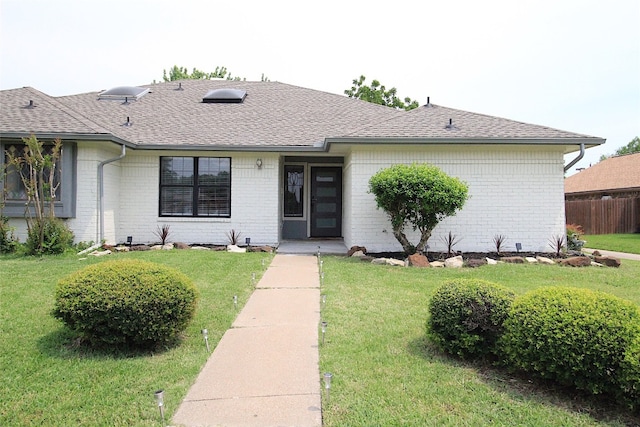 single story home with a front yard