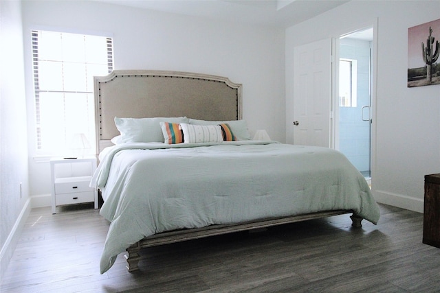 bedroom featuring dark hardwood / wood-style flooring