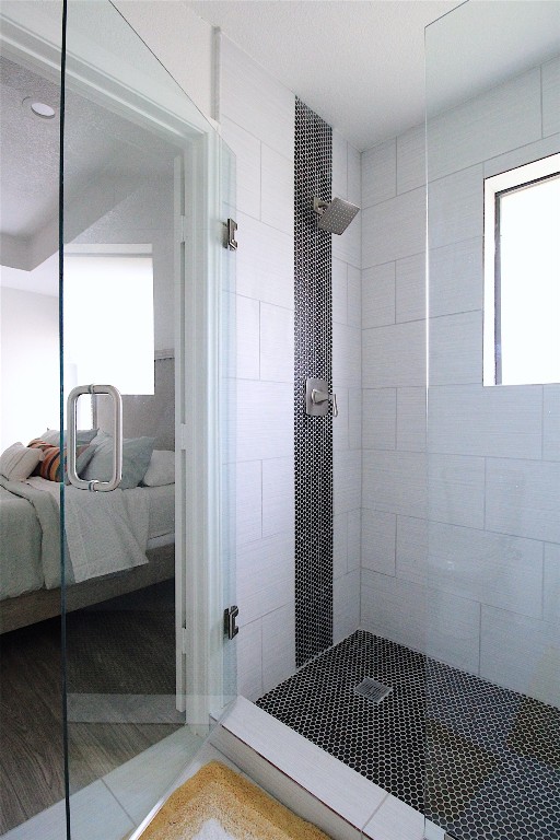 bathroom with a tile shower