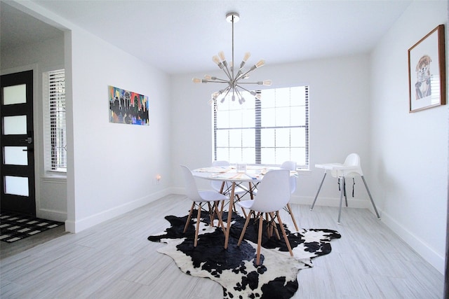 dining room with an inviting chandelier and light tile flooring