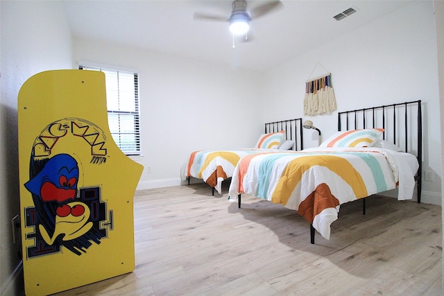 bedroom featuring light hardwood / wood-style floors and ceiling fan