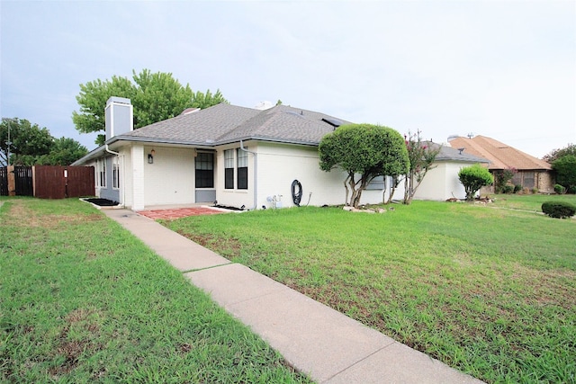 ranch-style home with a front yard