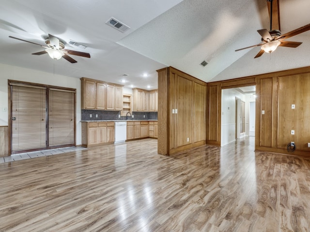 unfurnished living room with light hardwood / wood-style flooring, lofted ceiling, a textured ceiling, and ceiling fan