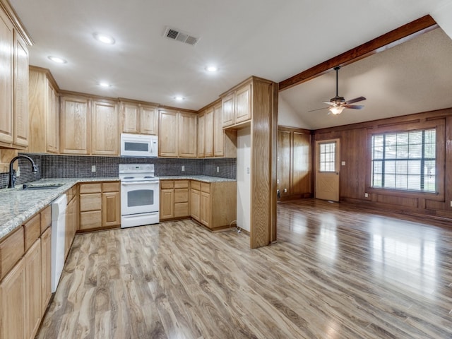 kitchen with light stone counters, vaulted ceiling with beams, sink, white appliances, and light hardwood / wood-style flooring