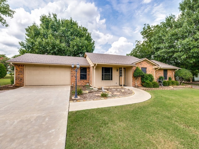 ranch-style home featuring a garage and a front yard