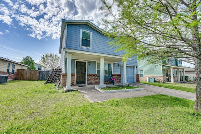 view of front of property with a front yard and a garage