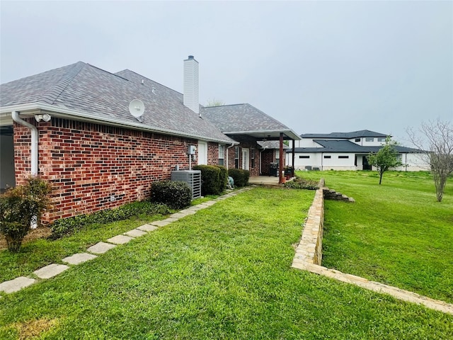 view of yard with central AC unit