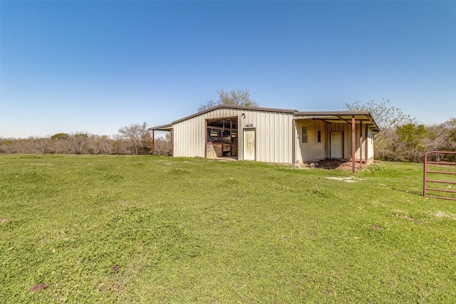 view of outdoor structure with a lawn