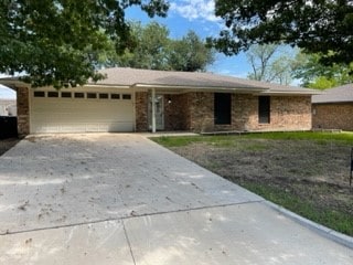 single story home with a garage