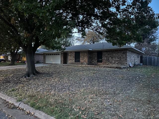 single story home featuring a garage