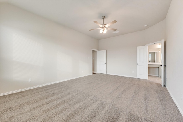 unfurnished bedroom featuring ensuite bathroom, light carpet, and ceiling fan