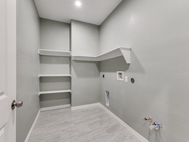 clothes washing area featuring hookup for a washing machine, hookup for an electric dryer, gas dryer hookup, and light tile floors