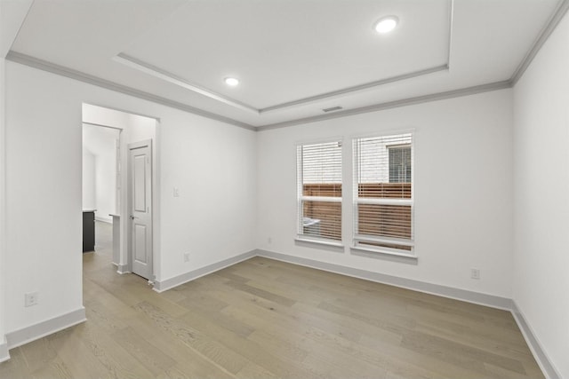 1841 Jasmine June, Mesquite, TX 75181 - empty room featuring recessed lighting, a raised ceiling, baseboards, and light wood finished floors