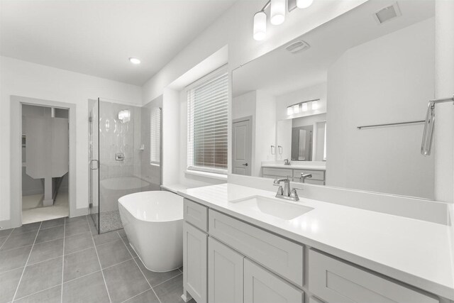 1841 Jasmine June, Mesquite, TX 75181 - full bathroom with visible vents, tile patterned flooring, a stall shower, vanity, and a soaking tub