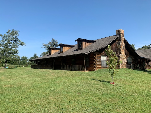 view of side of property with a yard