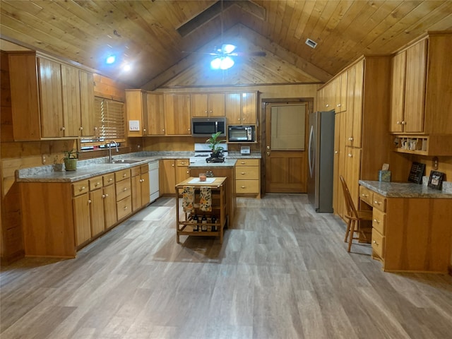 kitchen with wood walls, wood ceiling, light wood-type flooring, and stainless steel appliances