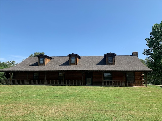 log-style house with a front yard