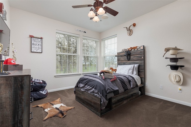 bedroom featuring dark carpet and ceiling fan