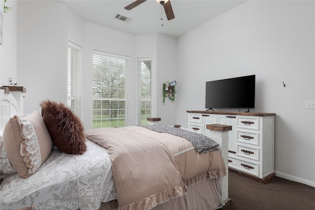 bedroom featuring ceiling fan and dark colored carpet