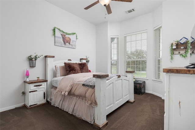 bedroom featuring dark carpet and ceiling fan