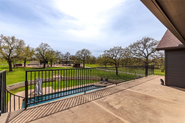 view of patio featuring a fenced in pool