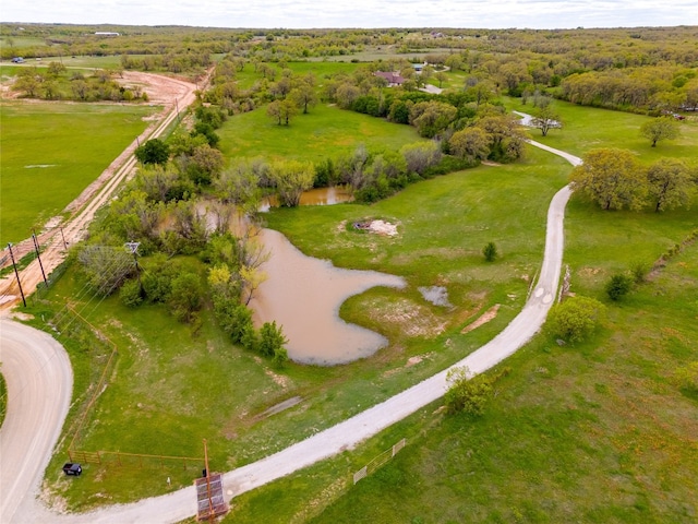 drone / aerial view featuring a rural view and a water view