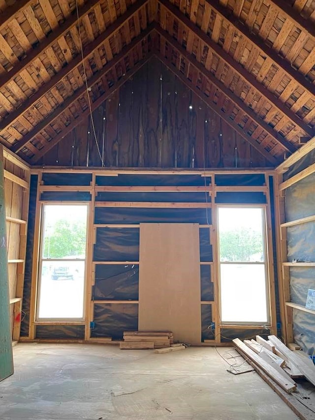 interior space featuring plenty of natural light and high vaulted ceiling