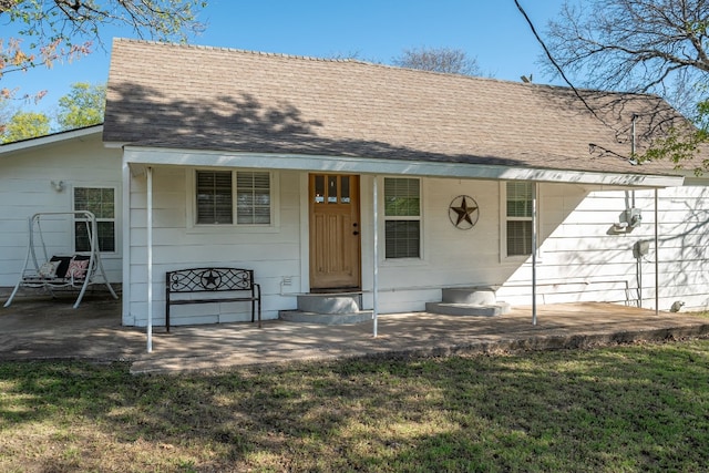 view of front of property with covered porch and a front yard