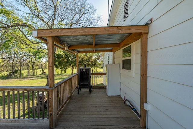 wooden deck with a yard