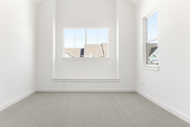 unfurnished room with carpet floors and a healthy amount of sunlight