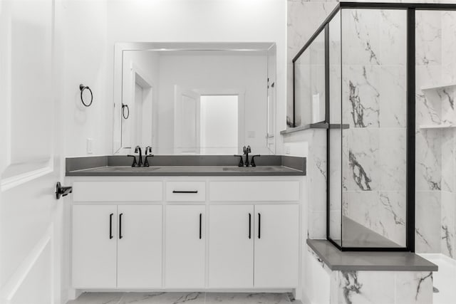 bathroom featuring walk in shower and vanity