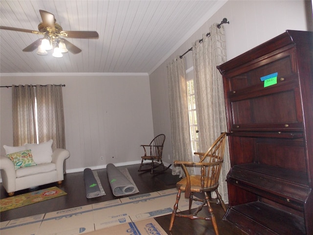 living room featuring wooden ceiling, ceiling fan, wood-type flooring, and crown molding