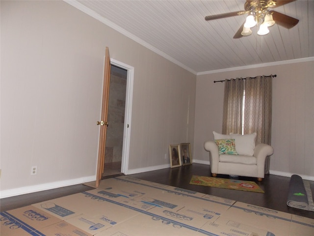 sitting room featuring dark wood-type flooring, ceiling fan, and ornamental molding