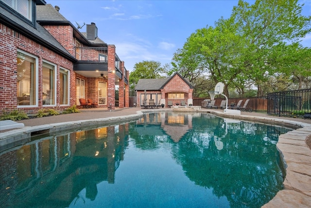 view of swimming pool featuring a patio