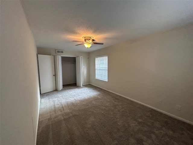 spare room with light colored carpet and ceiling fan