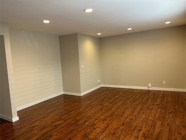 spare room with dark wood-type flooring