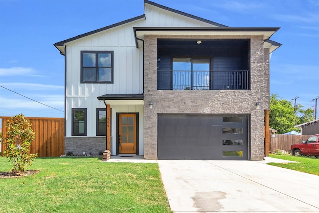 view of front of property with a balcony and a garage