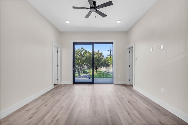 empty room with light wood-type flooring and ceiling fan