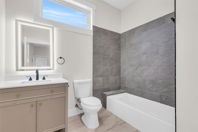 full bathroom with toilet, vanity, and tiled shower / bath