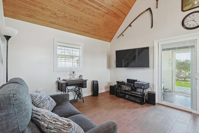 living area featuring vaulted ceiling, wooden ceiling, wood finished floors, and a healthy amount of sunlight