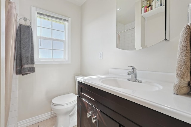 full bathroom with toilet, tile patterned floors, baseboards, and vanity