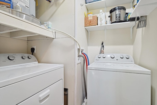 laundry room featuring laundry area and washing machine and clothes dryer