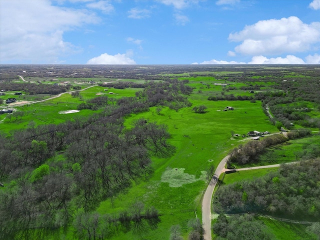 birds eye view of property with a rural view