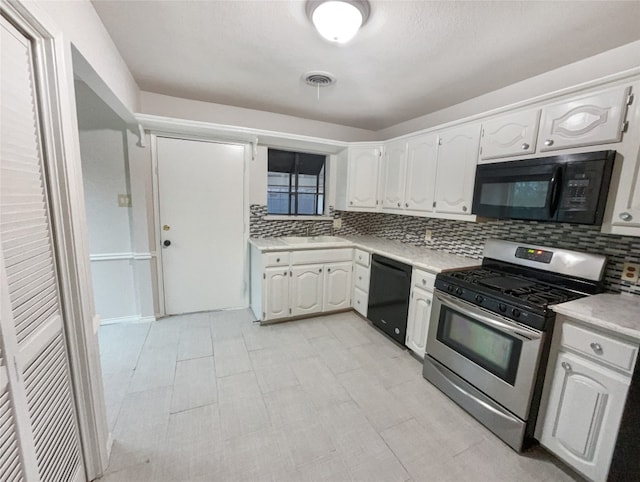 kitchen with light tile floors, backsplash, and black appliances