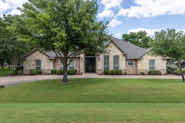 french country home with a front yard