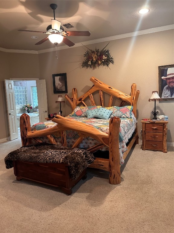 carpeted bedroom featuring ornamental molding and ceiling fan